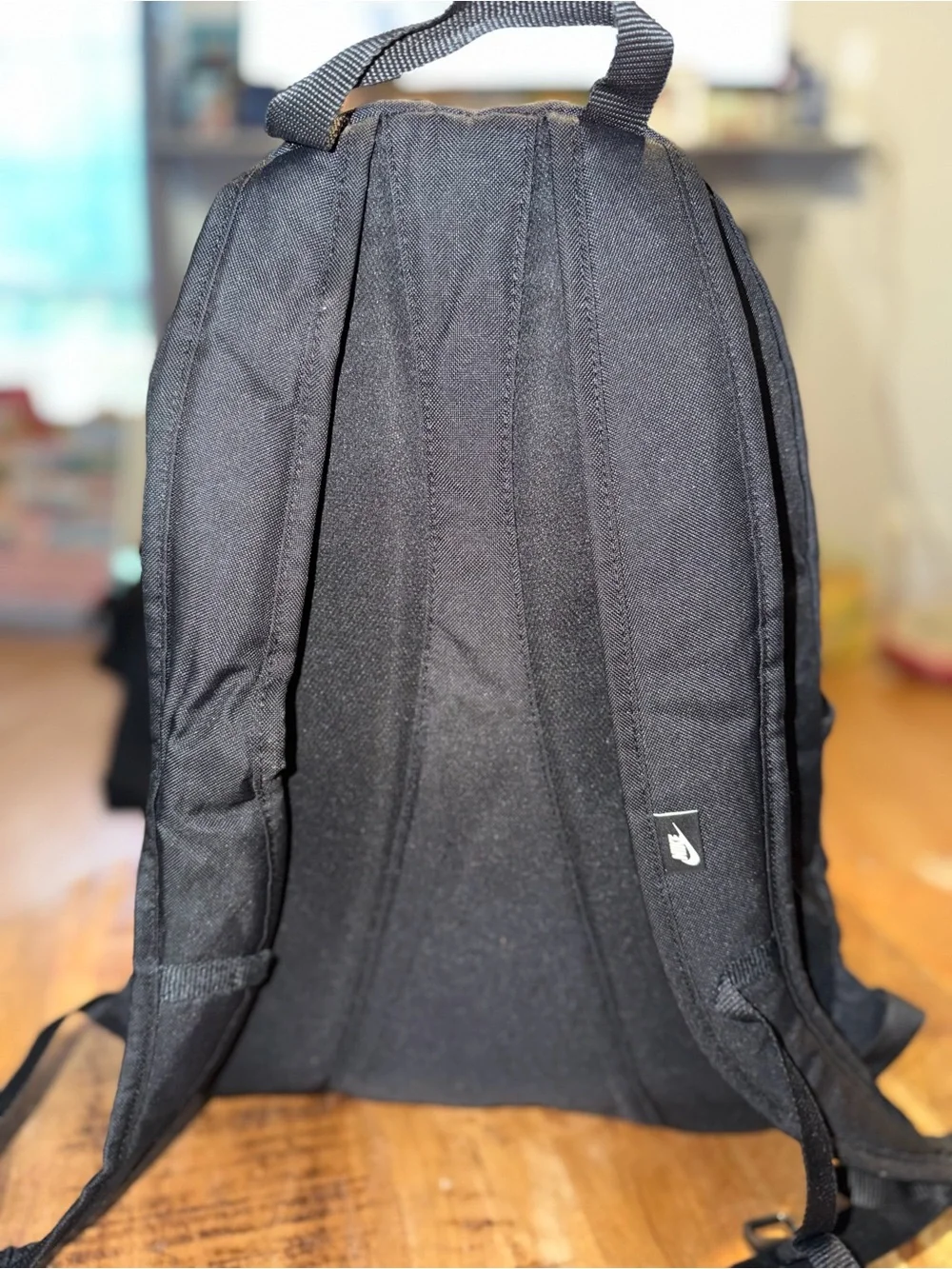 Nike Black Backpack with White Swoosh Graphic and Elastic Bungee